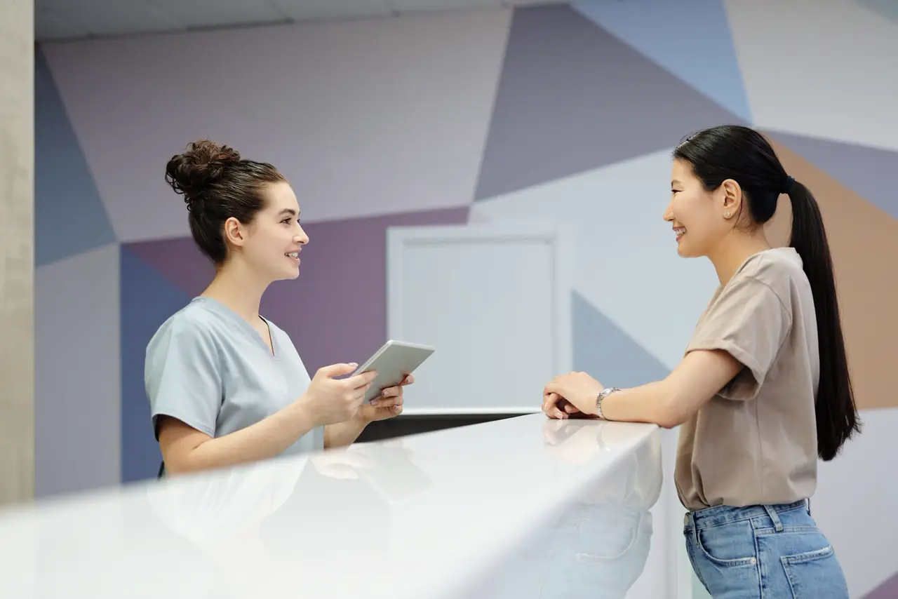 A med spa front desk with a tablet showing the week ahead.